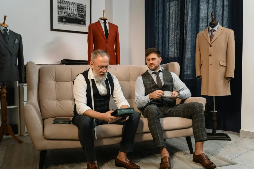 Men Sitting on a Couch in an Atelier